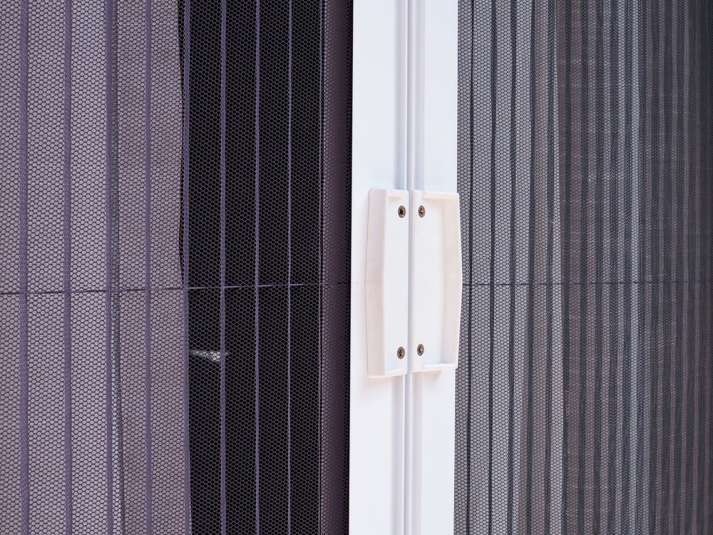 Close-up of a White Retractable Screen Door — Suburban Security Screens in Currumbin, QLD