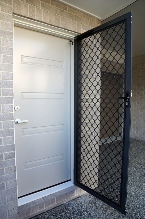 A Light-Colored Front Door Standing Open Behind a Black Diamond-Pattern — Suburban Security Screens in Currumbin, QLD