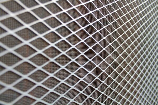 A Close-Up of A White, Diamond-Patterned Metal Mesh — Suburban Security Screens in Currumbin, QLD