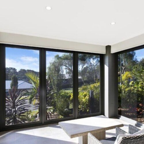 Sunlit Patio With Large Glass Windows — Suburban Security Screens in Currumbin, QLD