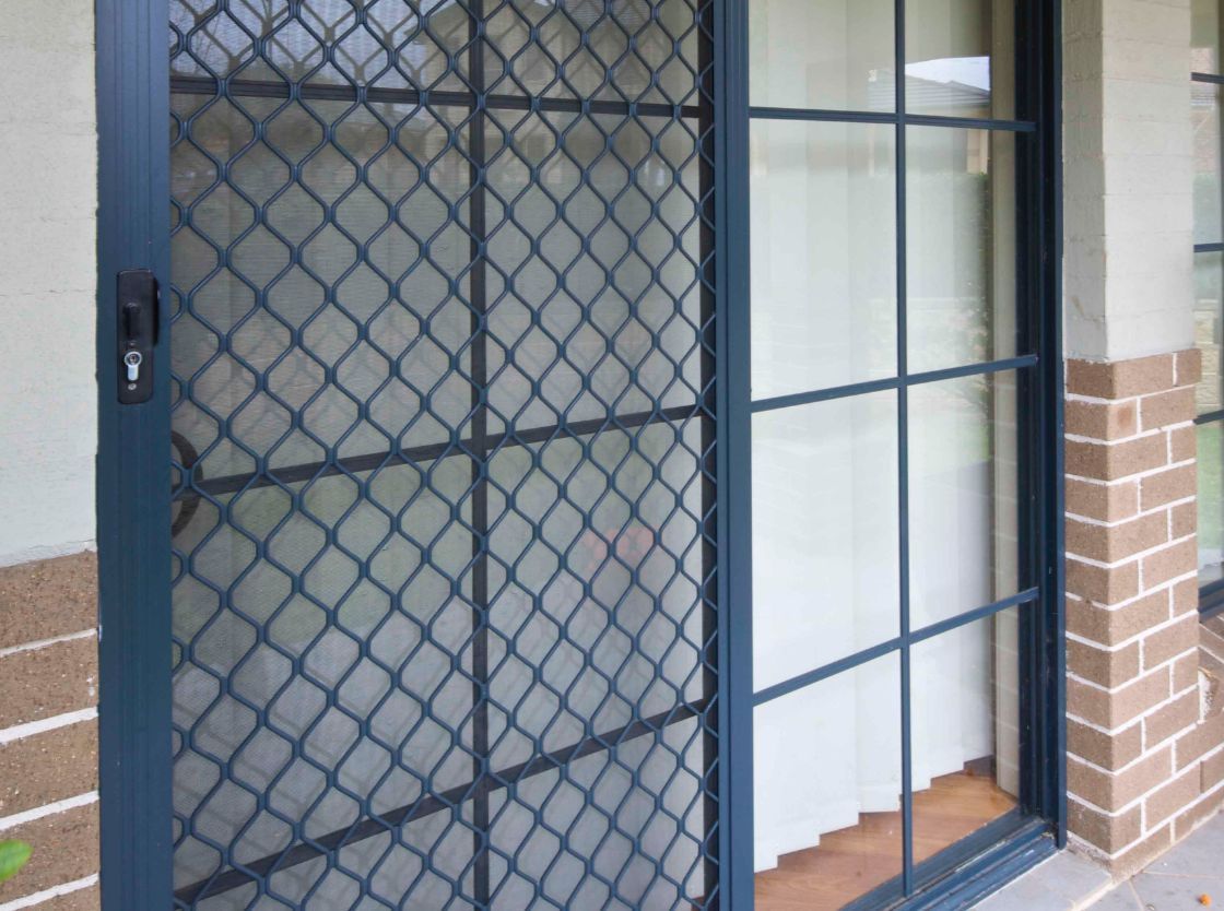 Dark-framed Sliding Security Screen Door — Suburban Security Screens in Currumbin, QLD