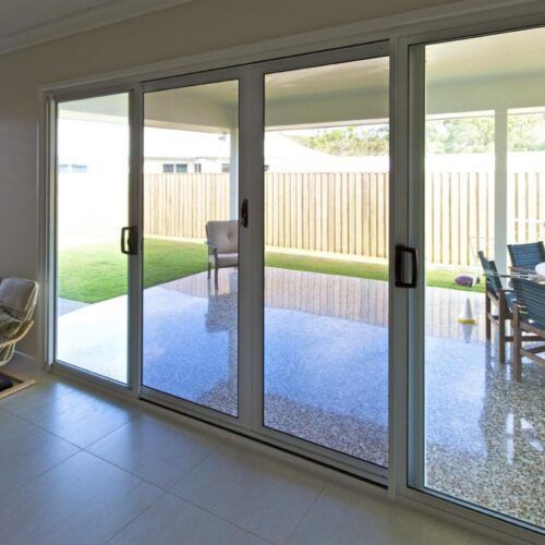 Set of Large Glass Sliding Doors Opening — Suburban Security Screens in Currumbin, QLD