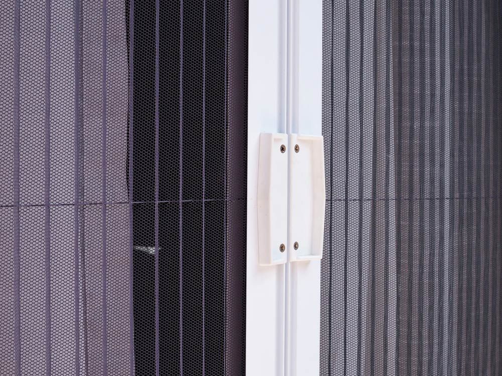 A White Handle Attached to A Vertical Frame — Suburban Security Screens in Currumbin, QLD
