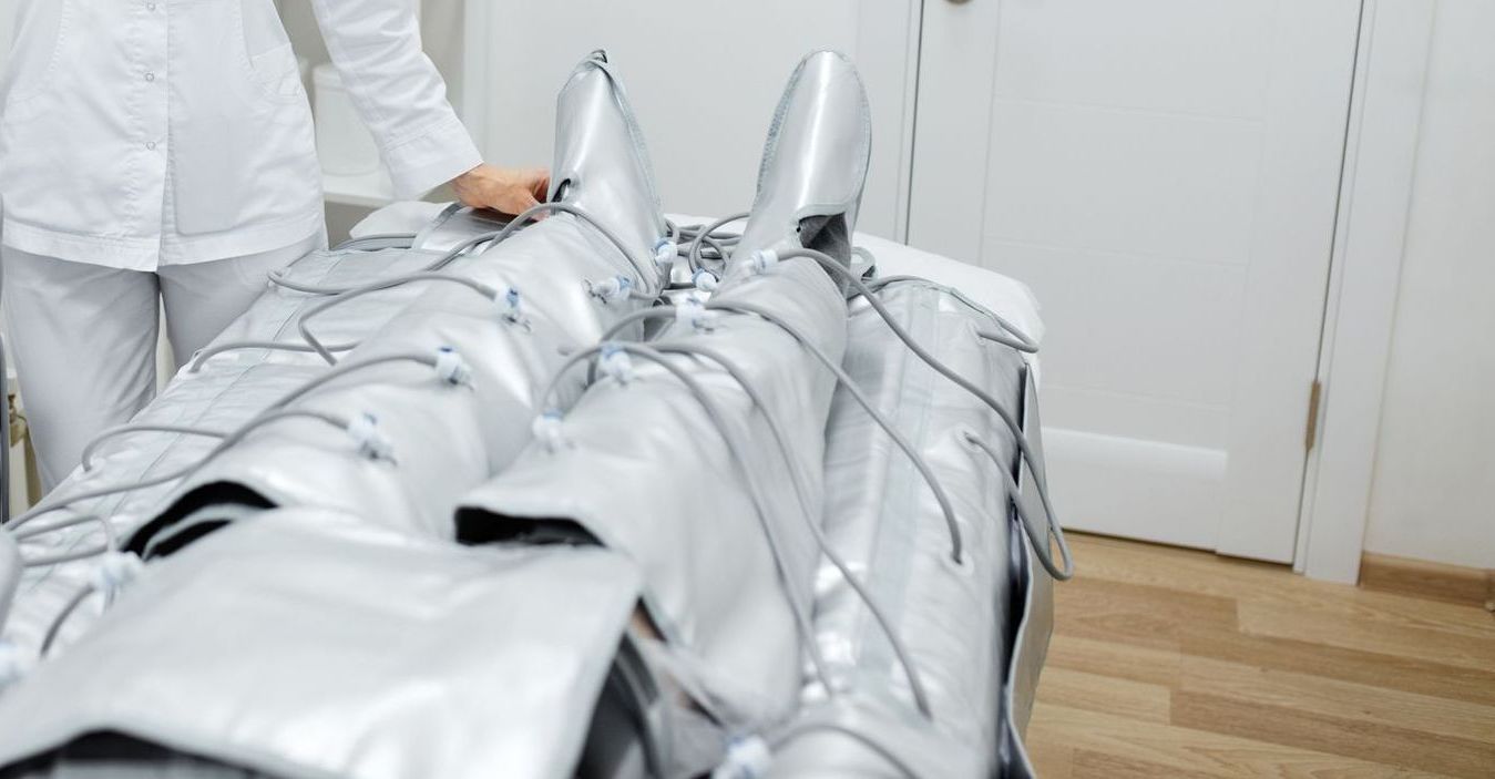 A woman is getting a laser treatment on her stomach.