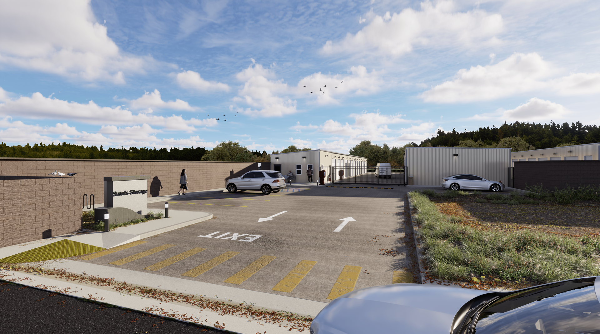 A white car is driving down a street next to a parking lot.