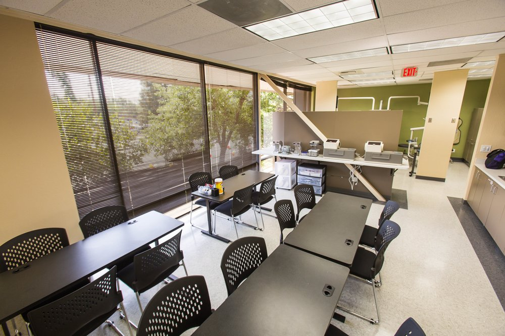 A large room with tables and chairs in it
