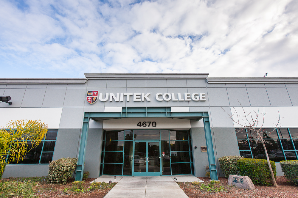 A large building with the name unitek college on it
