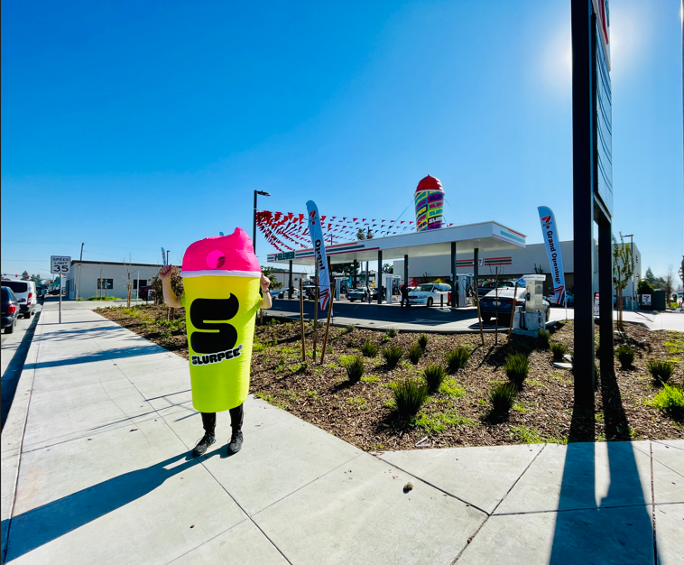 A person dressed as a cup with the letter s on it