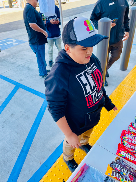 A young boy wearing a hoodie that says el 1972