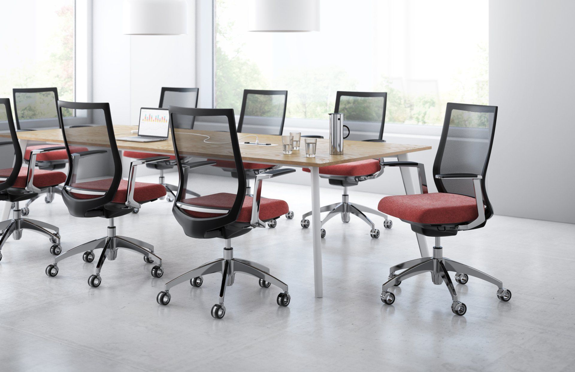 A conference room with a table and chairs in it.