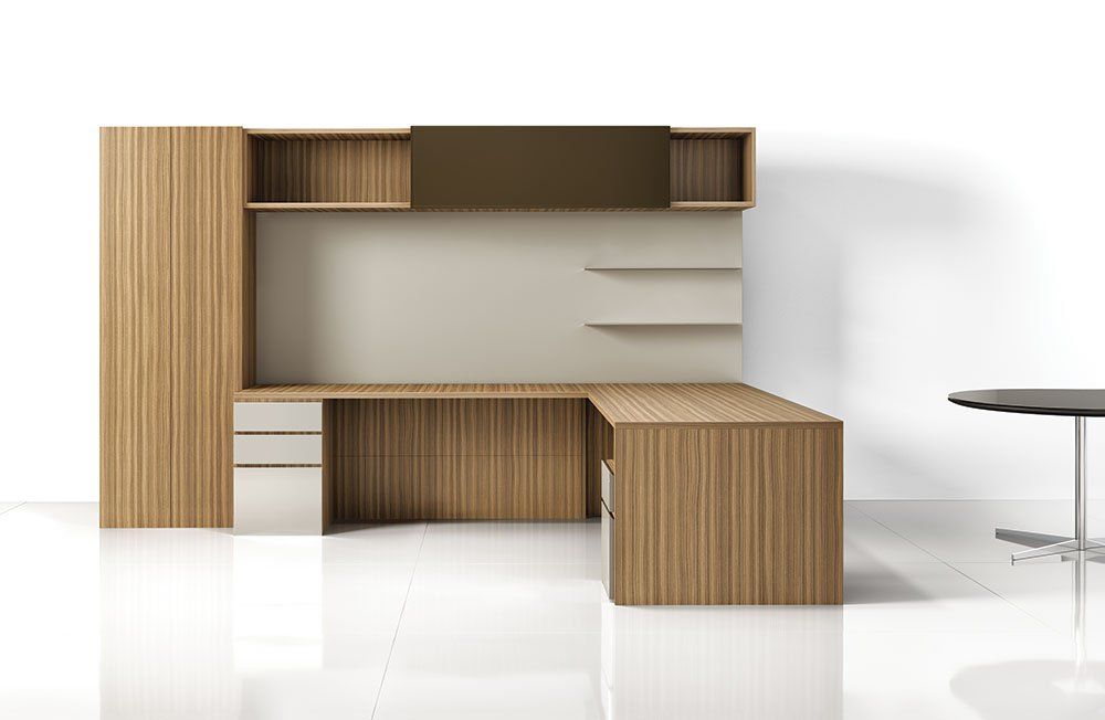 There is a desk and a table in the room.