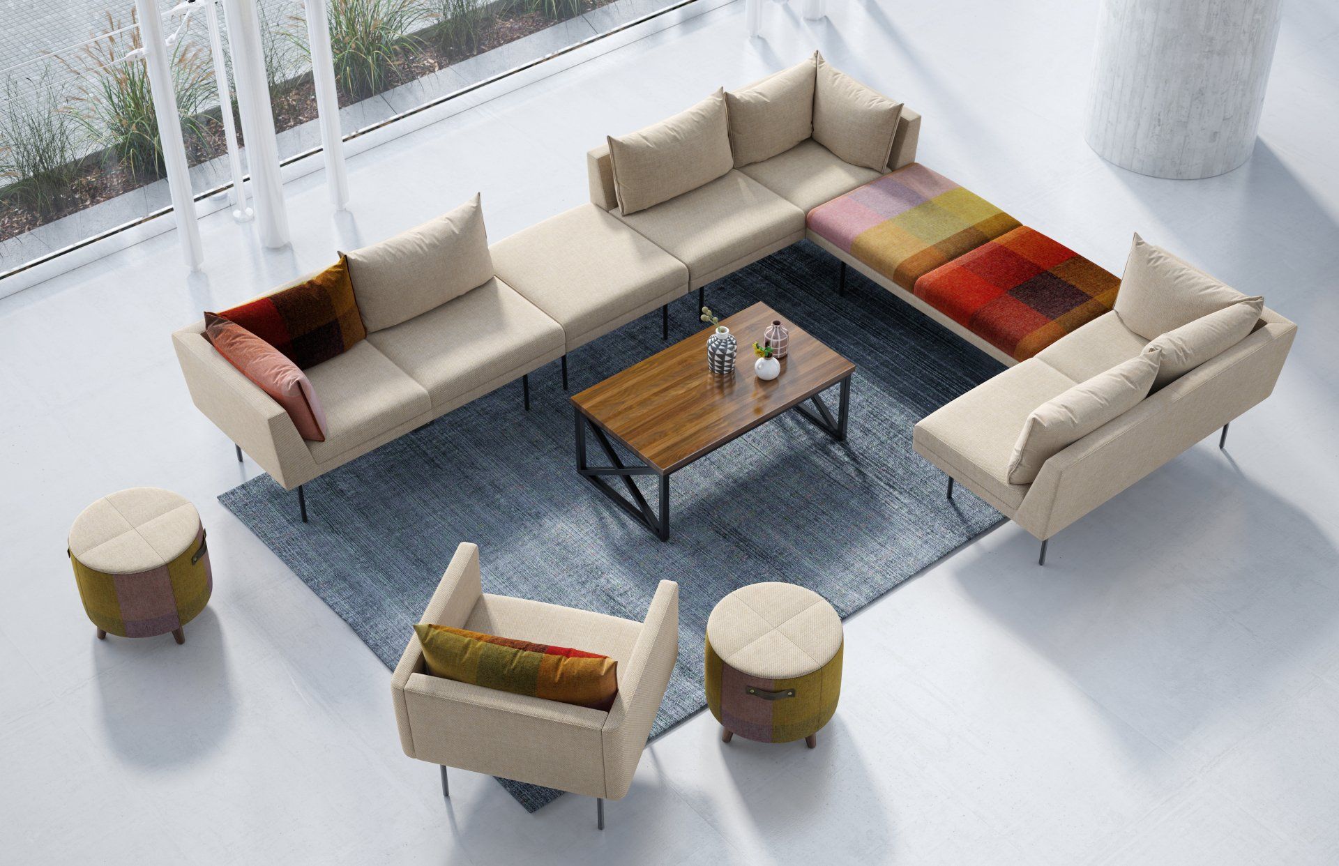 A living room with a couch , chairs , ottomans and a coffee table.