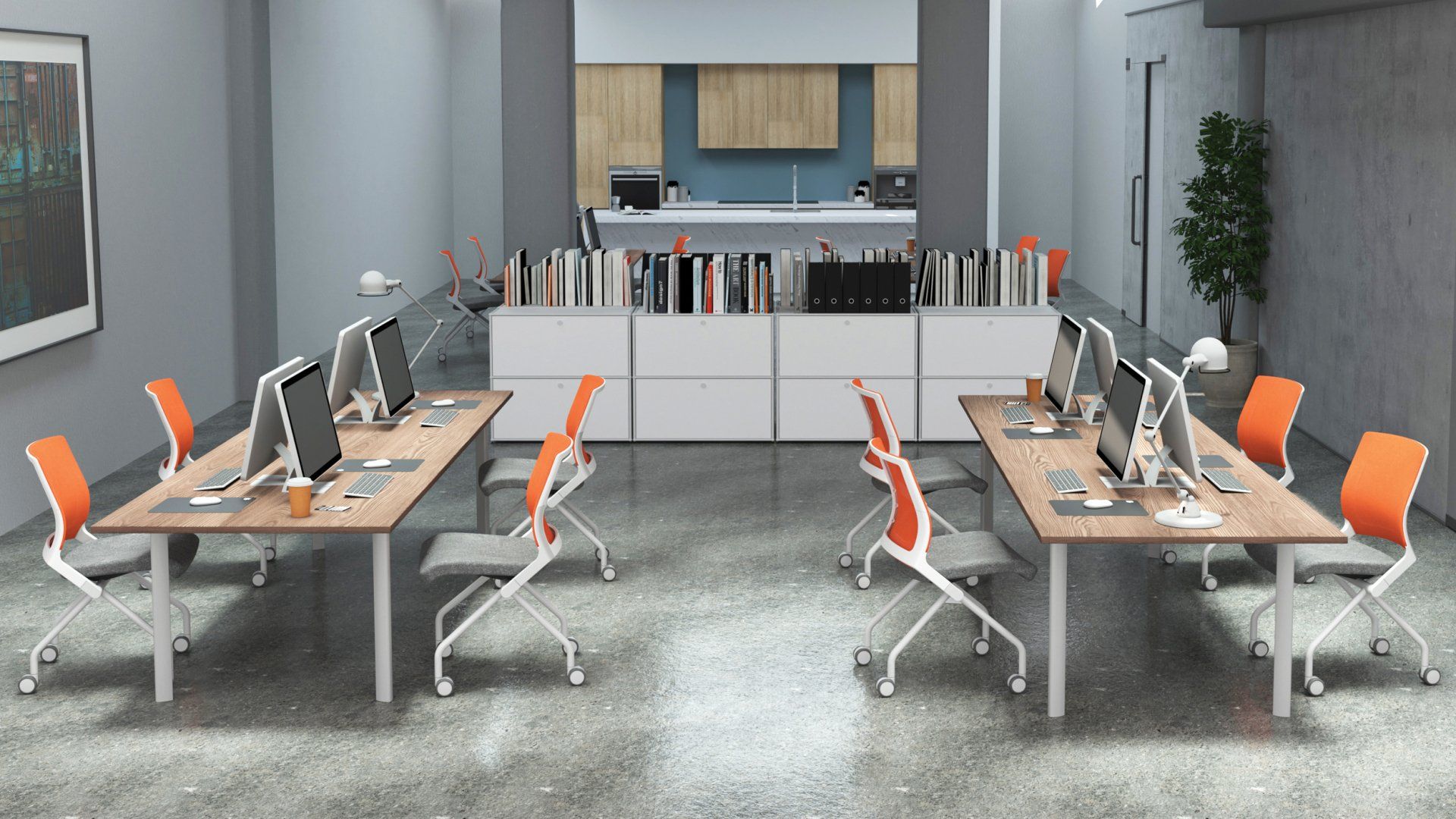 A room with a lot of desks and chairs with computers on them.