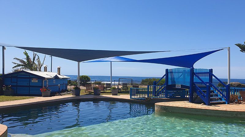 Swimming Pool Covered With Shade Sails — Professional Shade Sail Installations on the Central Coast, NSW