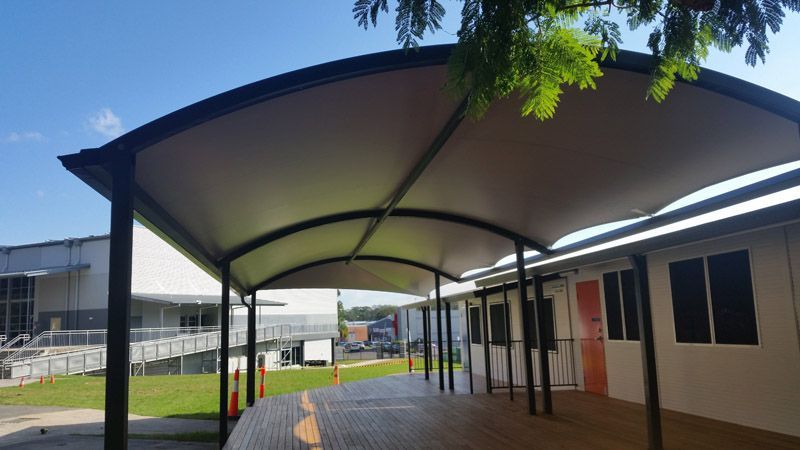 A Building With a Large Archway Shade — Waterproof Shade Sails on the Central Coast, NSW