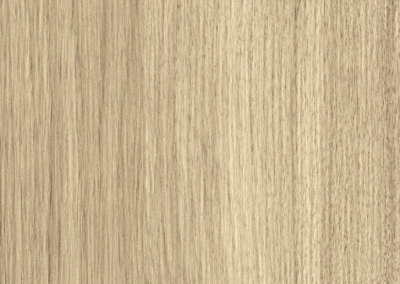 Un gros plan d'un morceau de bois montrant la texture du bois.