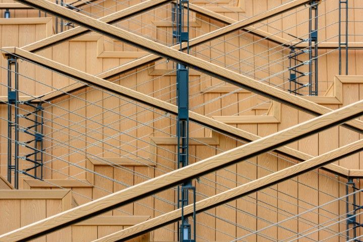 Diagonal wooden steps paired with sleek cable railing