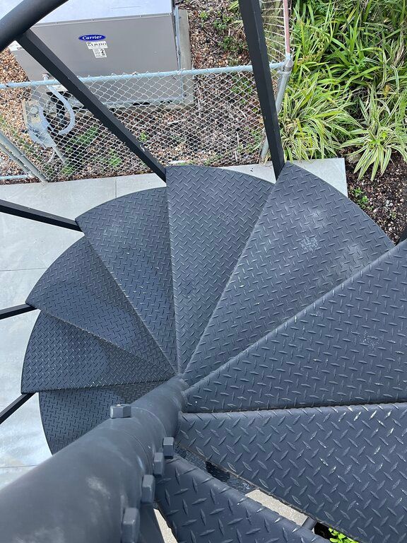 stainless steel treads on black spiral staircase