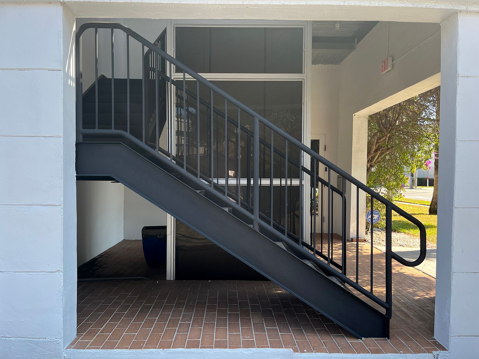 modern steel staircase in an office complex featuring precision-crafted pipe rails