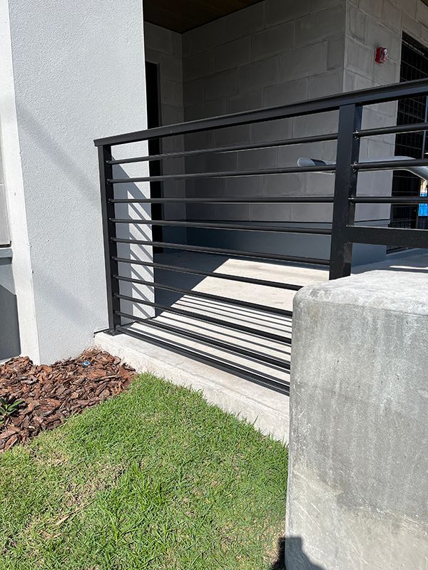 Law building's black railing with round rod