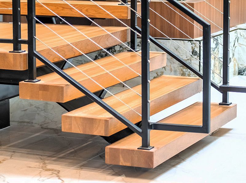 heavy wood treads with black cable railing