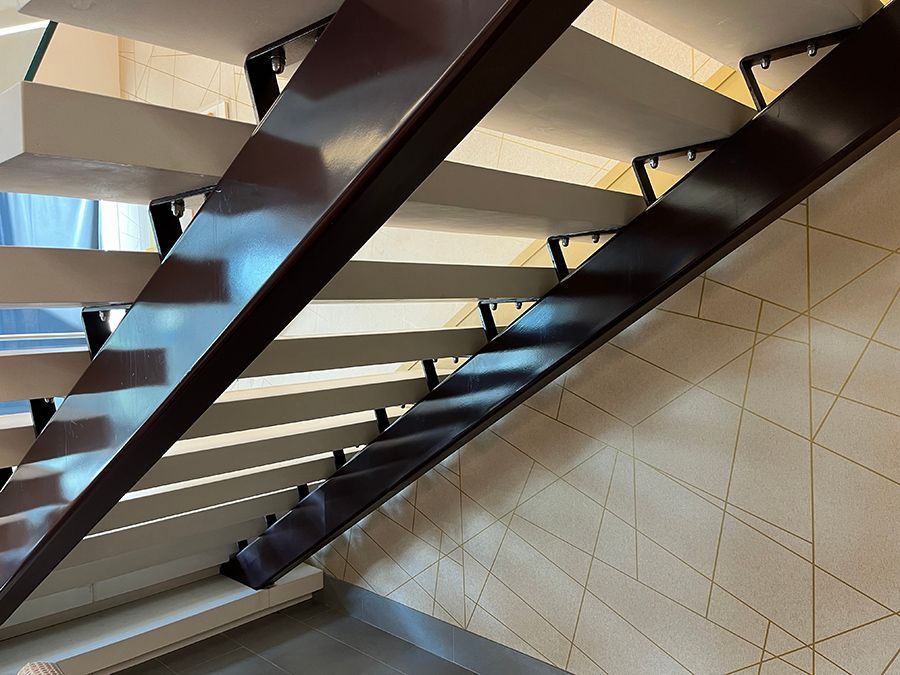 view from underneath a dual stringer floating stairs in a modern building