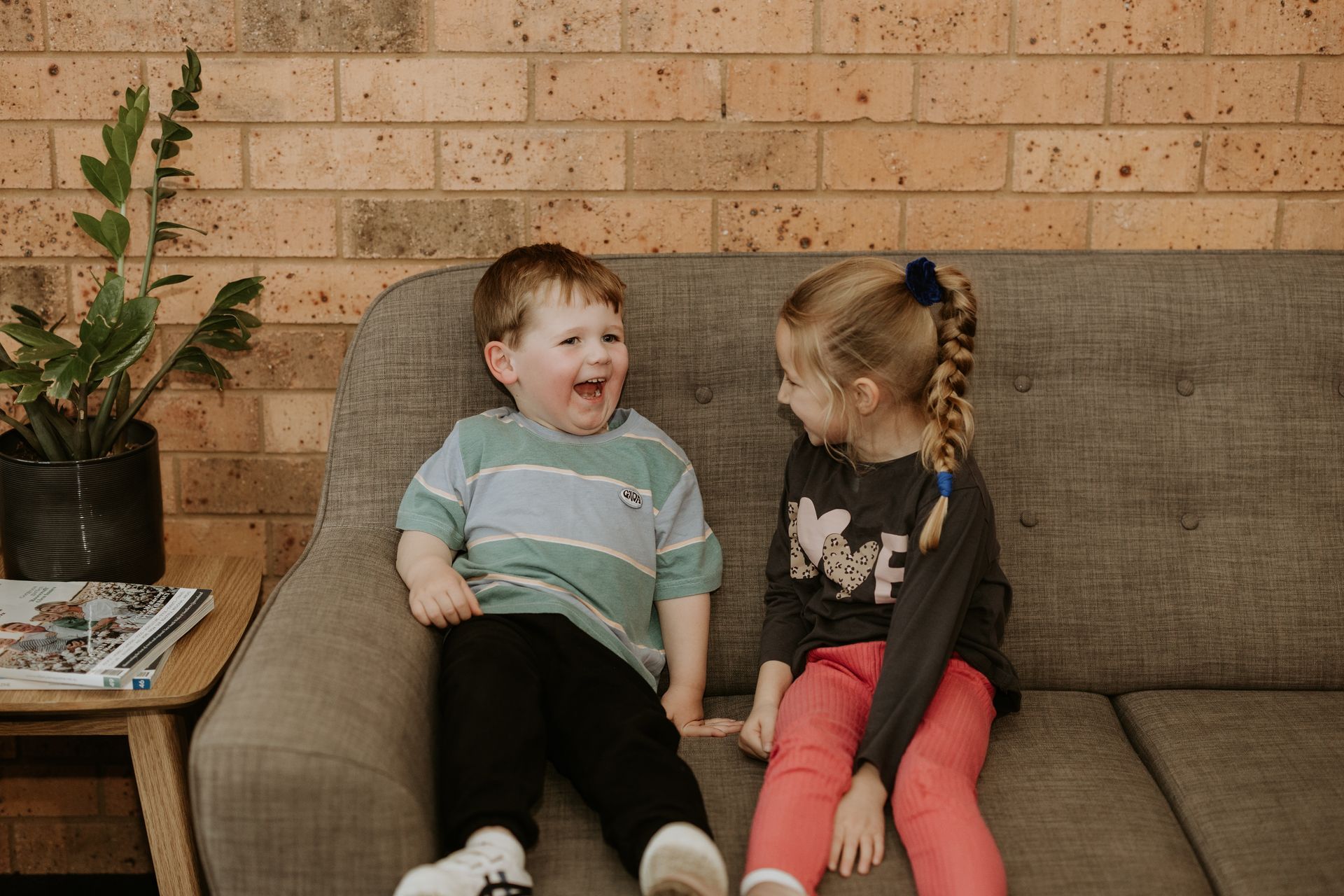 Young children sitting on a couch — Dubbo Dental in Dubbo, NSW