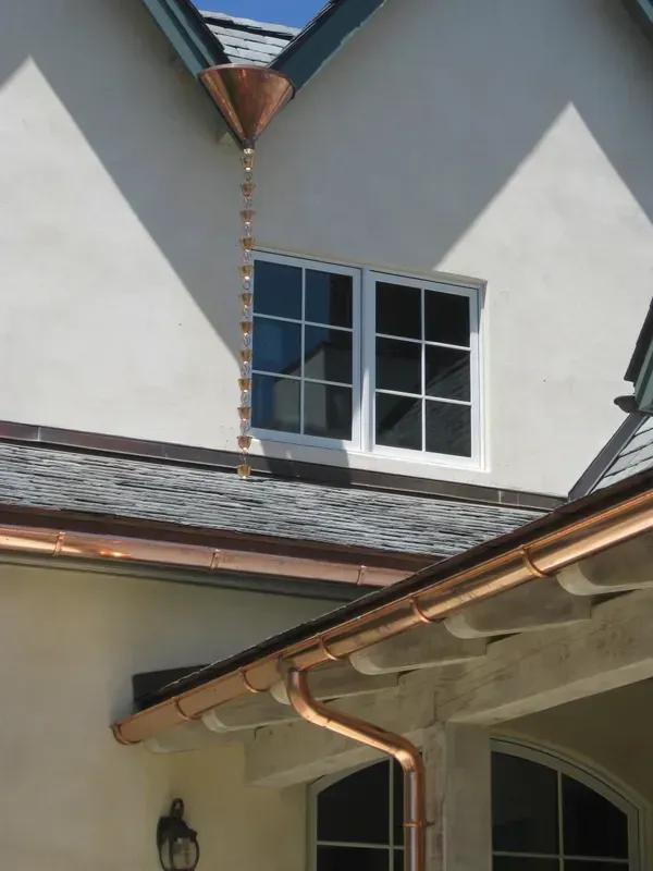 Copper Rain Chain Hangs from The Roof of A House | Santa Rosa, CA | Morris Heating and Sheet Metal