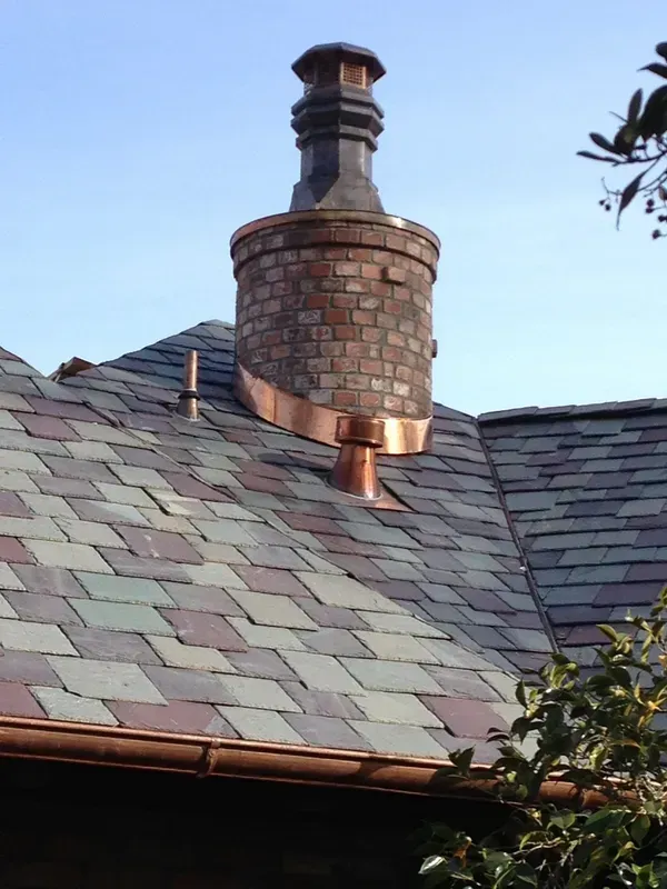 A Brick Chimney on Top of A Slate Roof | Santa Rosa, CA | Morris Heating and Sheet Metal