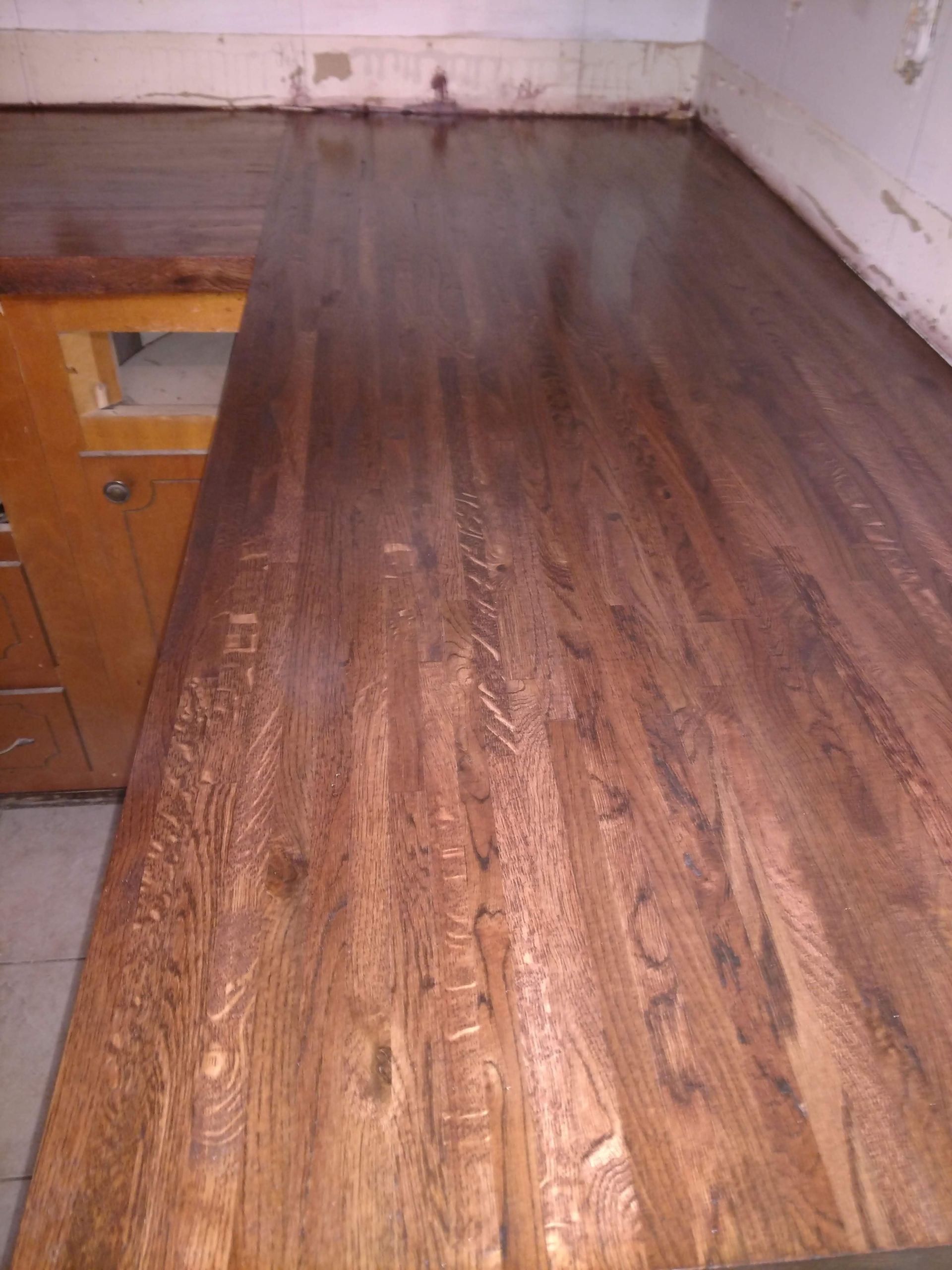 Wooden kitchen countertop with dark stain.
