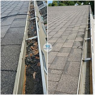 Using a high-pressure cleaner to clean rain gutters, effectively removing dirt, leaves, and debris buildup.
