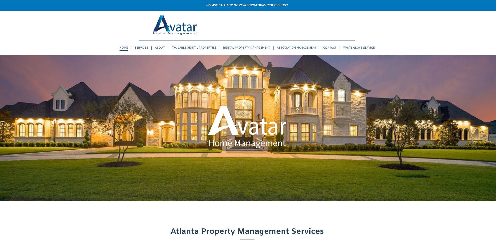 A large house is sitting on top of a lush green field.