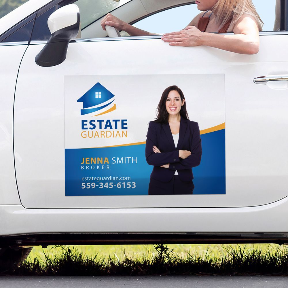 A woman is sitting in a car with a estate guardian magnet on the door.