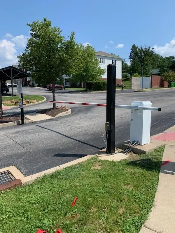 A parking lot with a barrier in the middle of it