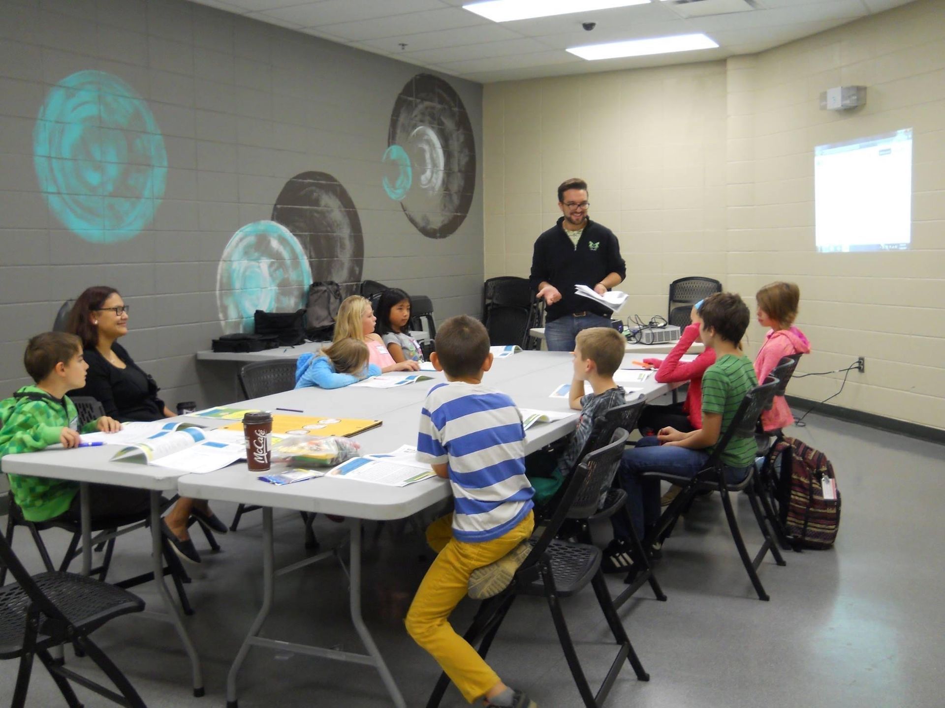 Jonathan Berube teaching financial literacy to young students in Alberta