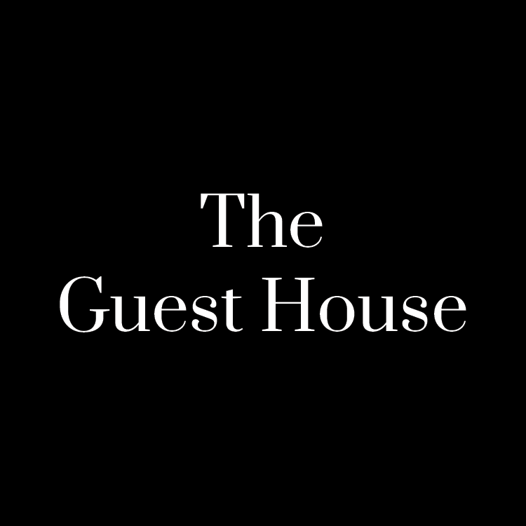 Text that reads The Guest House