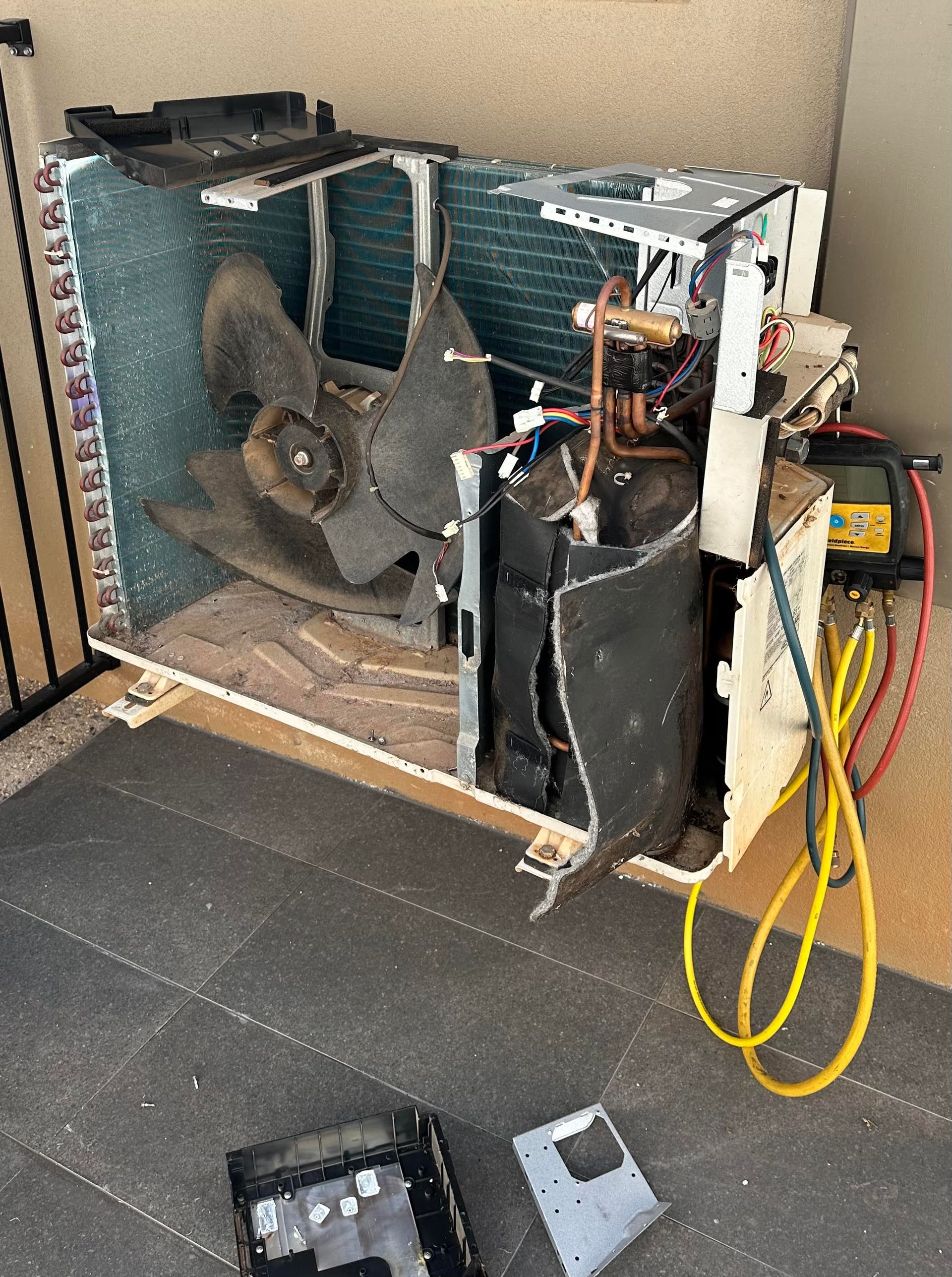 An Air Conditioner being repaired — Eclipse Air Conditioning and Refrigeration in Trinity Beach, QLD