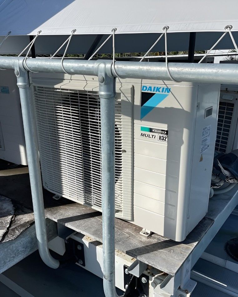 A Daikin Air Conditioner is Sitting on Top of a Metal Platform — Eclipse Air Conditioning and Refrigeration In Trinity Beach, QLD