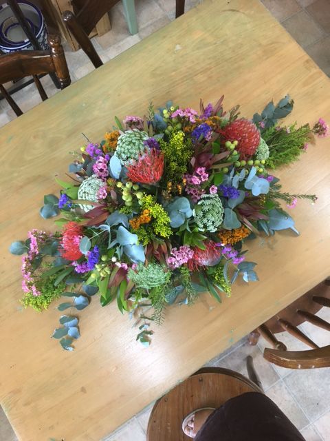 A Wooden Table Topped with A Bouquet of Flowers — Fiori With Love in Ingham, QLD