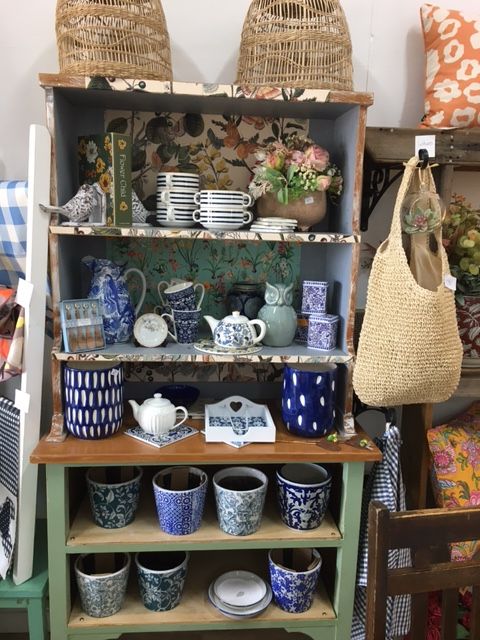 A Shelf with A Lot of Pots and Plates on It — Fiori With Love in Ingham, QLD