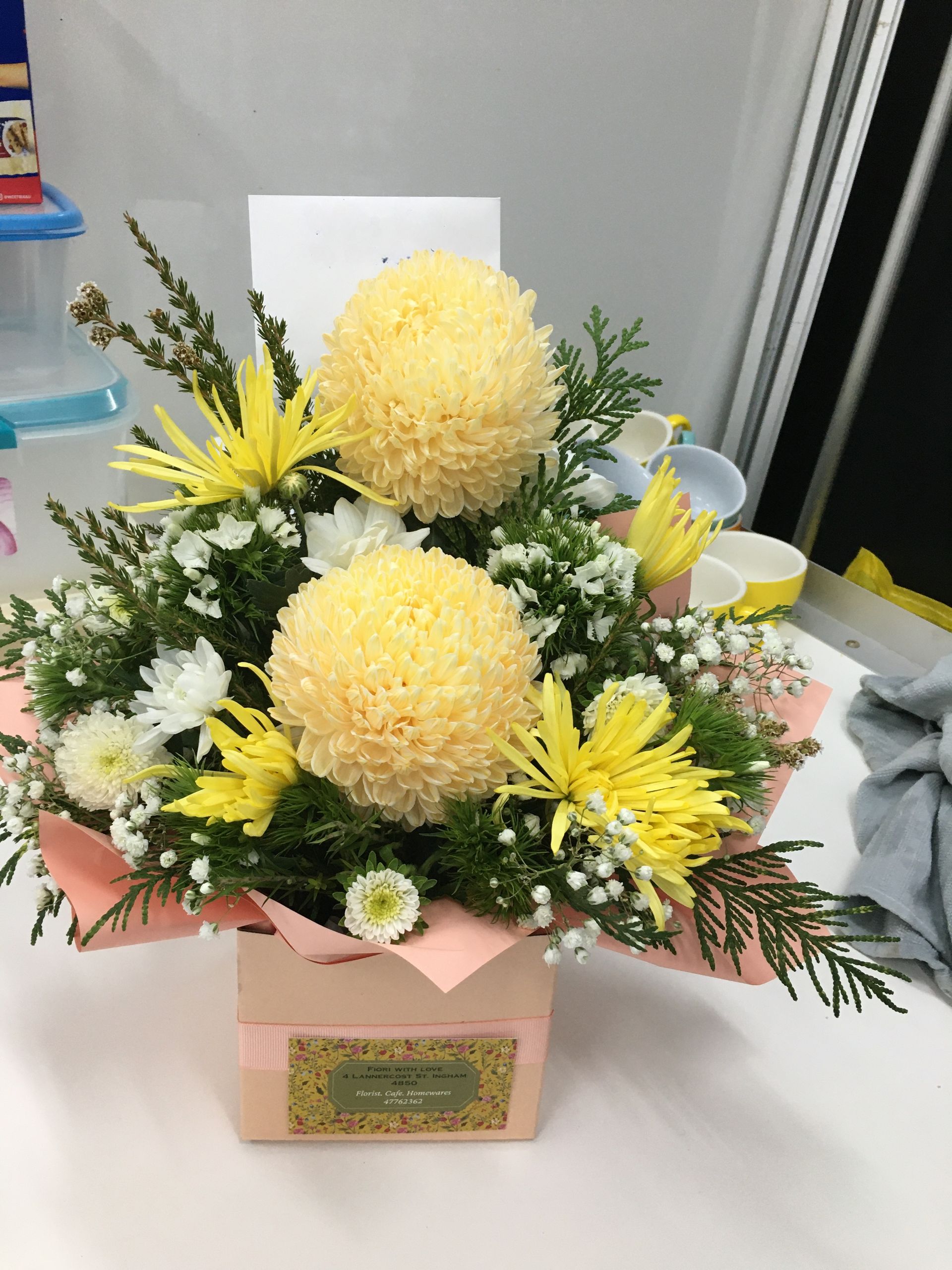 A Pink Box Filled with Yellow and White Flowers — Fiori With Love in Ingham, QLD