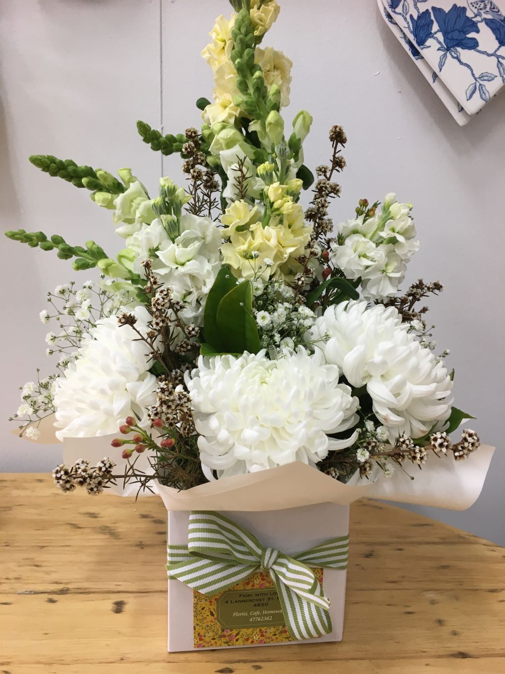 A Box Filled with White Flowers and Yellow Flowers — Fiori With Love in Cardwell, QLD