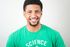 A man wearing a green shirt that says science on it