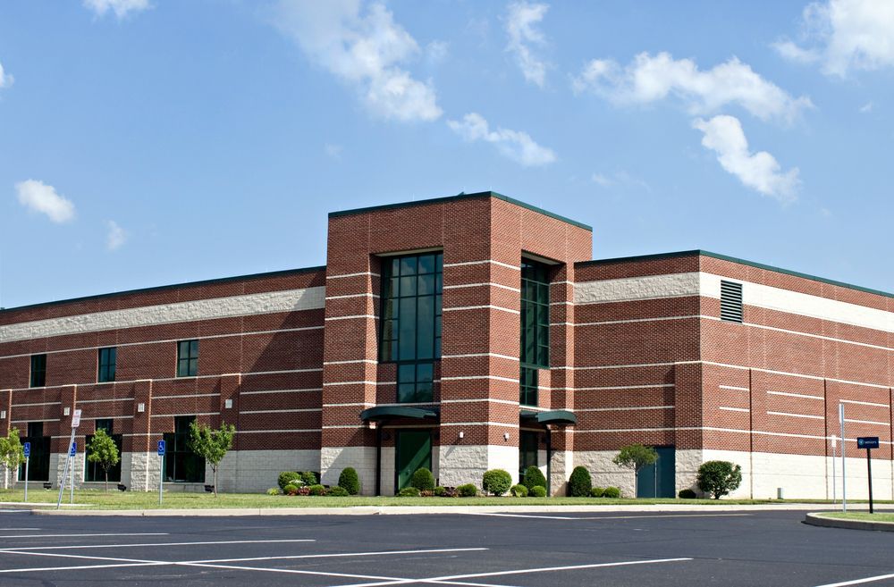 a large brick building with a lot of windows