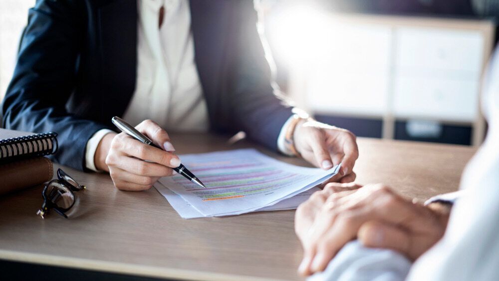 Three People Standing Next to Each Other in Front of a Body of Water — TJL Business Advisors and Accountants in  Forster, NSW