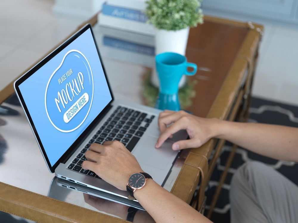 A Person is Typing on a Laptop Computer on a Table — TJL Business Advisors & Accountants in Forster, NSW