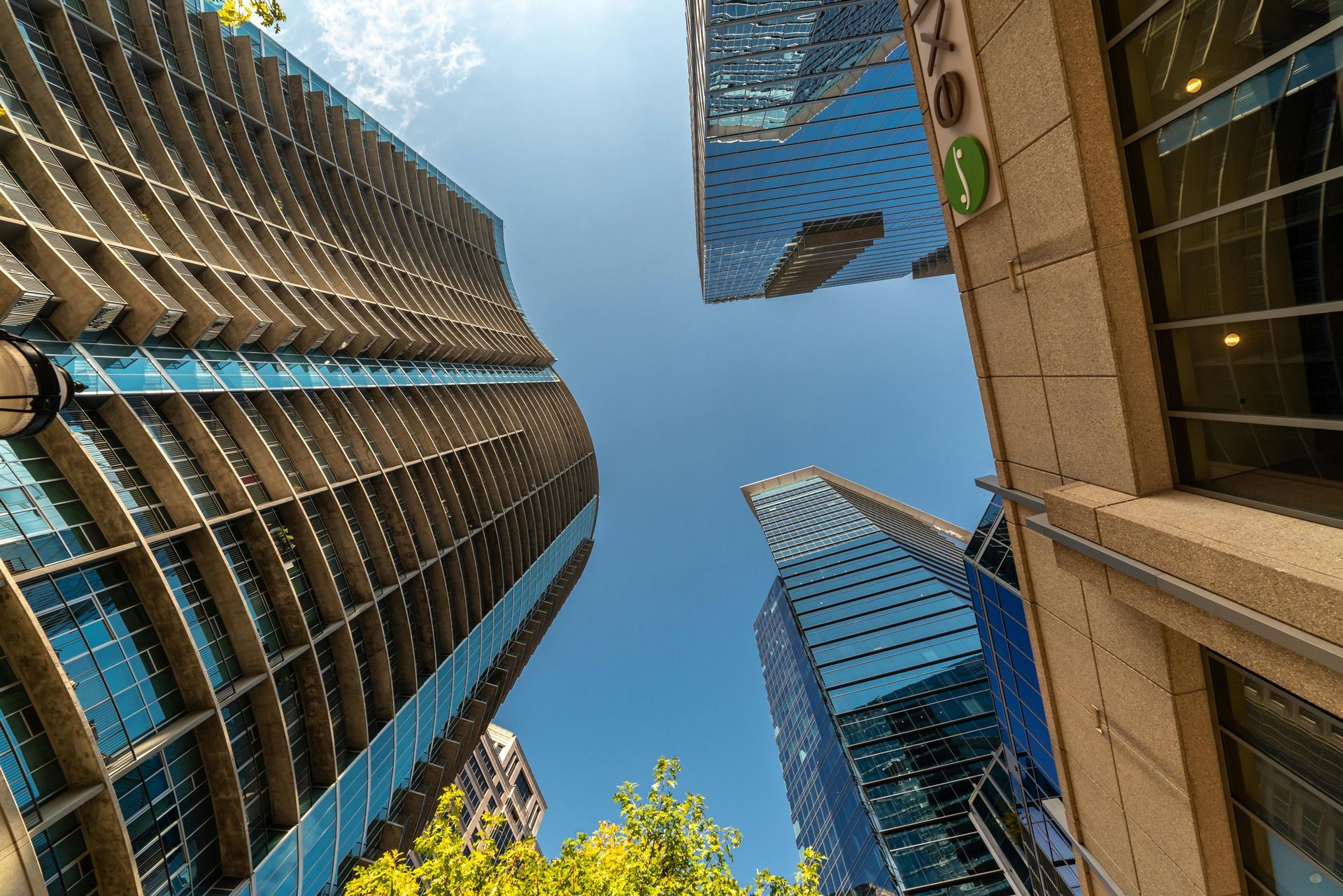 Looking up at a skyscraper in a city