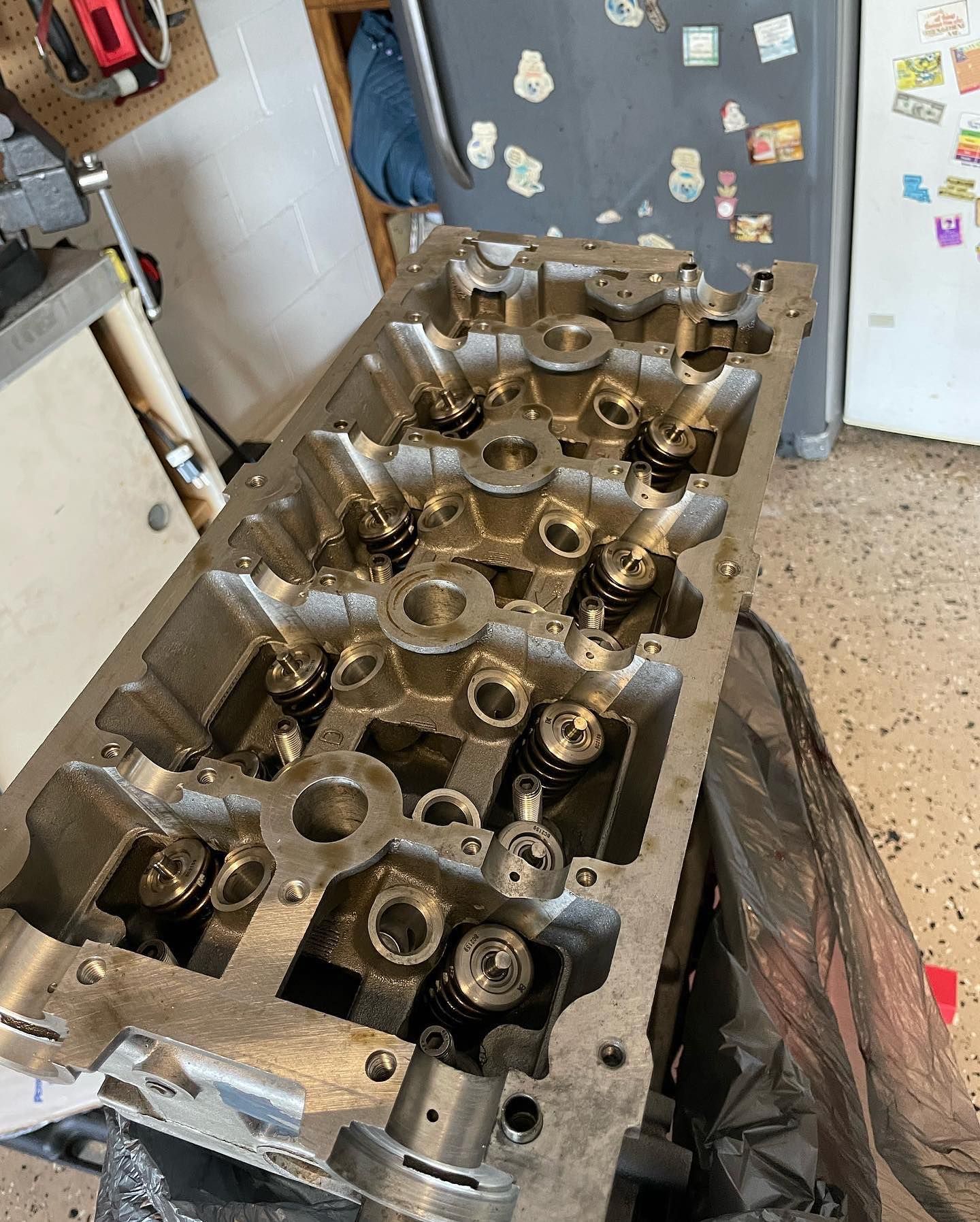 Engine cylinder head, silver metal, with valves and components | DMP Mobile Auto Repair