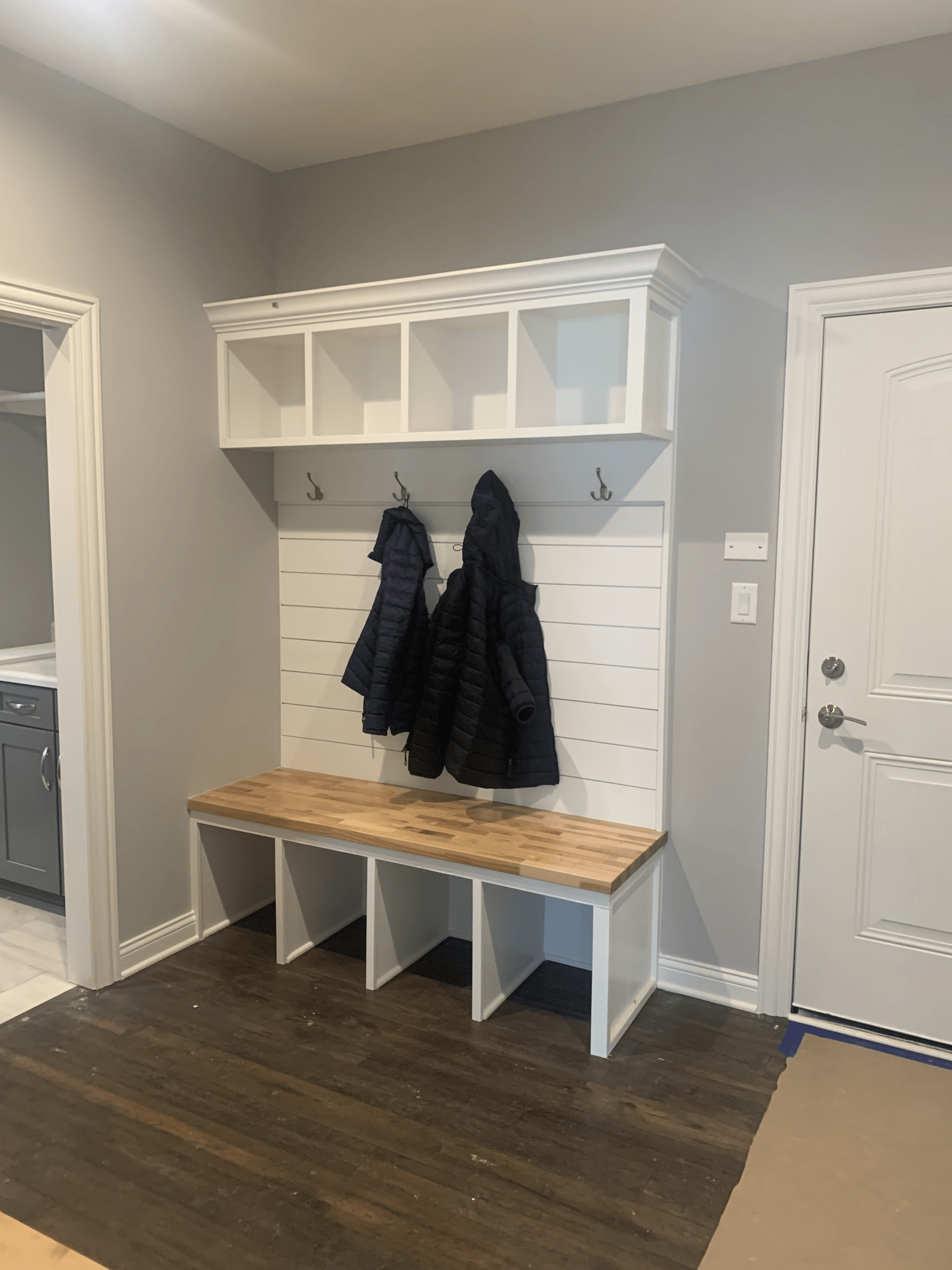 Mudroom Locker With Jacket — Dyer, IN — Cugini Woodworking LLC