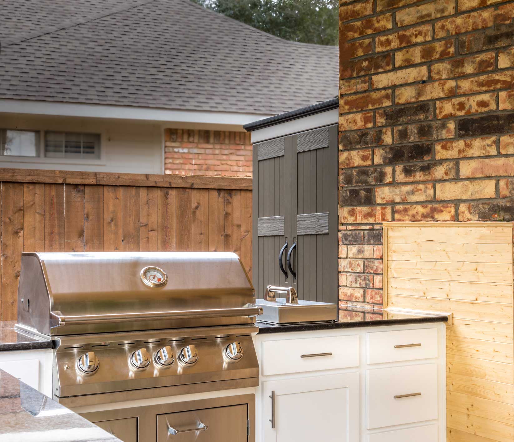 Our custom outdoor kitchen cabinets in Dyer, Crown Point, and Valparaiso, Indiana seamlessly integrate with best-in-class appliances, like this stainless-steel grill.